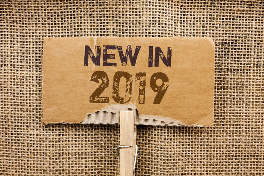 Writing note showing New In 2019. Business photo showcasing Fresh Era Latest Year Period Season Annual Coming Modern written Cardboard Piece Holding By Clip the jute background.