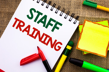 Writing note showing Staff Training. Business photo showcasing Teaching Teamwork new things Employee Education Preparation written Notebook Book the jute background Sticky Note Papers Pens