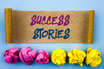 Handwriting text showing Success Stories. Concept meaning Successful Inspiration Achievement Education Growth written tear sticky note Paper the blue background Folded paper