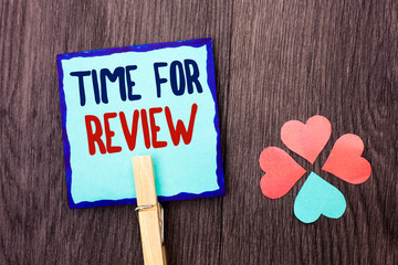 Handwriting text writing Time For Review. Concept meaning Evaluation Feedback Moment Performance Rate Assess written Sticky Note Paper Holding With Clip the wooden background Hearts.