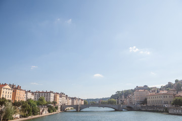 Fototapeta na wymiar Panorama of Saone river and the Quais de Saone riverbank and riverside in the city center of Lyon, next to the Colline de Fourviere Hill