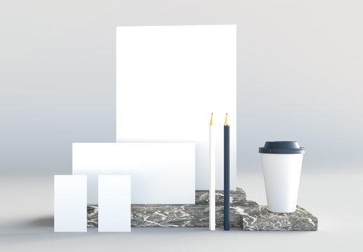 Set Mockup of stationery elements on marble base. 3D render.