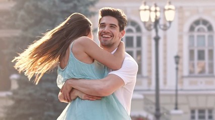Young happy loving couple walking outdoors at the street having fun - Powered by Adobe