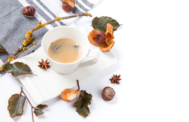 Autumn composition. Cup of coffee and leaves on white background. Flat lay, top view, copy space Autumn
