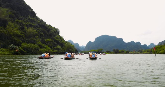 Boat cruise in Trang An, Ninh Binh province, near Tam Coc - famous tourist destination with many caves - UNESCO World Heritage Site