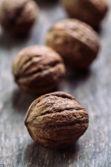 Walnuts with and without shells (filling the picture). Background of fresh walnuts.