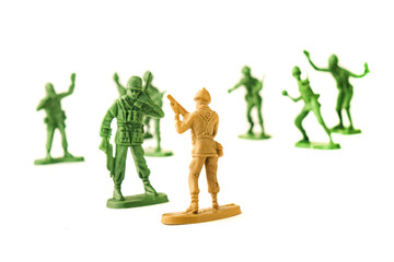 miniature toy soldiers on white background, close-up