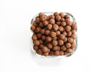 sweet corn chocolate balls in a glass plate on a white background