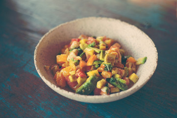 Delicious fruits salad in plate on table close-up