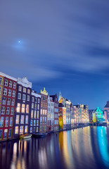 Fototapeta na wymiar Night cityscape in Amsterdam with old brick houses
