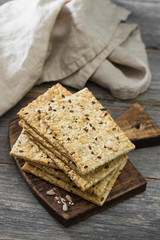 Grain loaves on a wooden Board on a wooden gray background. For healthy nutrition