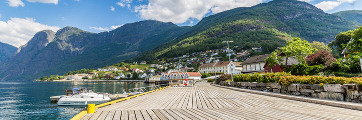 Village Aurlandsvangen at the coast of Aurlandsfjord, branche of Sognefjord and starting point of the National Scenic route Aurlandsfjellet - obrazy, fototapety, plakaty