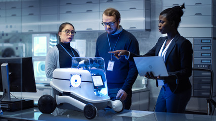 Multi Ethnic Team of Male and Female Leading Scientists Work on Innovative Robotics Technology. They Work in a Modern Laboratory/ Research Center.