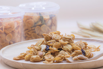 Delicious cereal caramel cornflakes warm tone background. A Breakfast cereal made by flakes of corn.