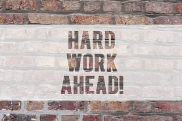 Writing note showing Hard Work Ahead. Business photo showcasing A lot of job expected big challenge activities required Brick Wall art like Graffiti motivational call written on the wall