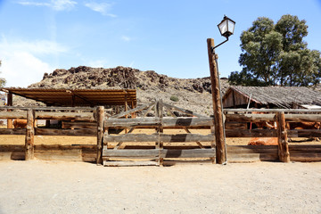 Wild west and wooden shed and fence in the old town.