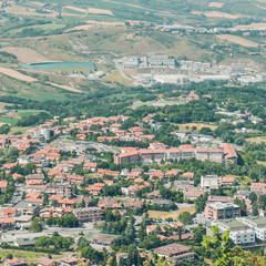 Fototapeta na wymiar Panorama of Republic of San Marino. San Marino Suburban districts and Italian hills view from above. 