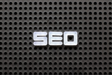 Black color pegboard with white letter in word SEO (Abbreviation of search engine optimization)