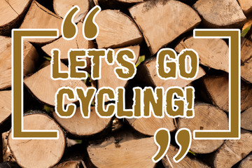 Writing note showing Let S Is Go Cycling. Business photo showcasing inviting someone to sport or activity of riding bicycle Wooden background vintage wood wild message ideas intentions thoughts