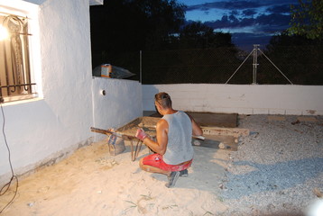 Builder Man in Red Shorts Doing Construction