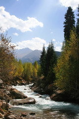 Mountain river with clear water in the fall.