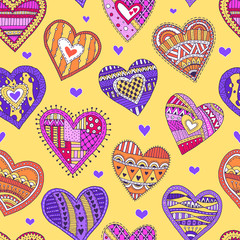 Vector seamless pattern with colored hearts on yellow background. Hand-drawn
