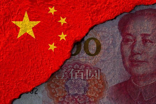 China flag and Mao Tse Tung face on Chin Yuan banknote print screen on crack wall. Yuan banknote is the main currency in the world.