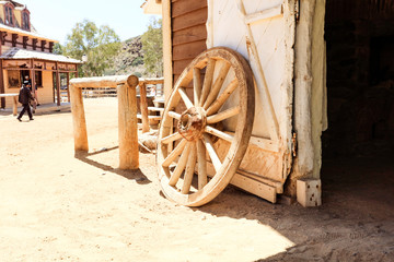 Wild west and wooden shed and fence in the old town.