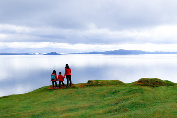 Fototapeta na wymiar Family enjoying tranquility of nature at Isle of Skye, Scotland