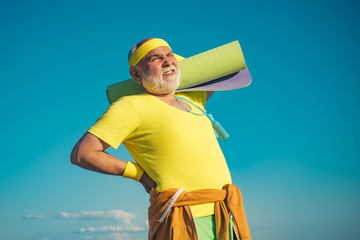 Fit senior man resting after working out. Senior sportsman in sport center. Sporting. Portrait of healthy senior sport man. Active sport workout for old person.