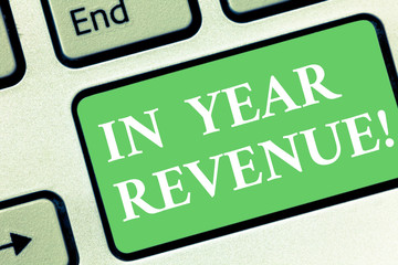 Conceptual hand writing showing In Year Revenue. Business photo showcasing Annual business income economical financial analysis Keyboard key Intention to create computer message idea