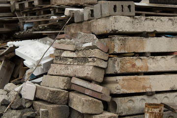 Weathered used building materials and dirty mess.