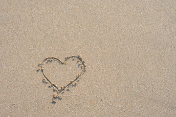 Fototapeta na wymiar Sand surface and heart shape