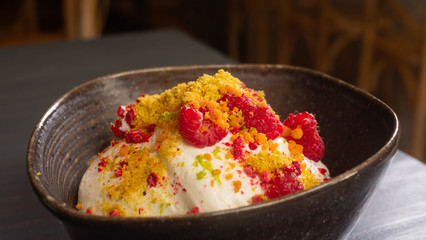 Sweet summer dessert. Ice cream in glass bowl with fresh strawberries, fruits and muffins.