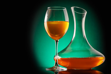 Amber wine in a glass and decanter