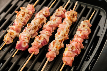 Cooking souvlaki on grill