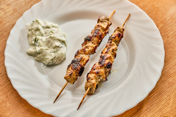 Souvlaki and tzatziki on plate