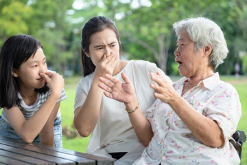 Asian senior grandmother talking to her family,elderly people bad breath,daughter,granddaughter...