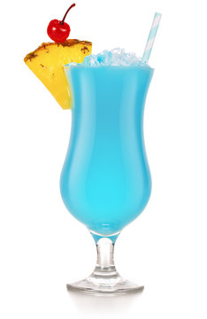 Fototapeta blue hawaiian coctail garnished with pineapple and cherry