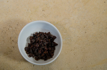 raisins on white plate, ingredient of 