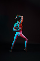 Fototapeta na wymiar Unrecognizable dancer in leotard performing with arms bent behind back