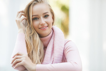 Closeup portrait of young beautiful woman. Female outdoors.