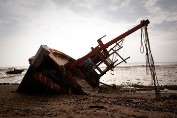 Fototapeta premium local fishing boat and the sea sunset