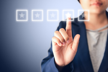 Business Entrepreneurs Woman is Choosing Quality Performance Certification and Satisfaction Stars Rating Feedback for Improvement on Multimedia Touch Screen., Poll Rate of Qualification and Satisfied