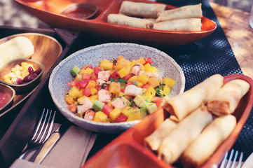 Delicious fruits salad in plate on table close-up