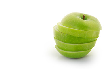 green apple  sliced on a white background