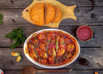 stuffed zucchini flowers in tomato sauce