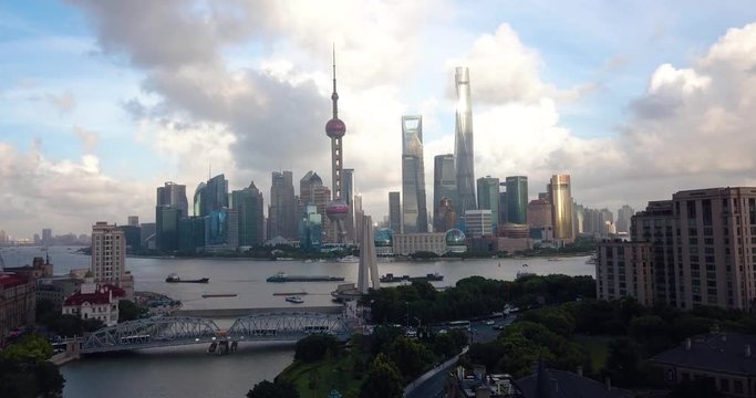 Shanghai skyline aerial footage with amazing skyscrapers rising above Haungpu river cityscape in China