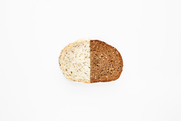 A slice from halves of fresh and rye bread isolated on white.