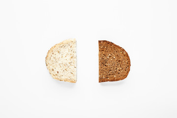 Slices of white and rye bread isolated on white.